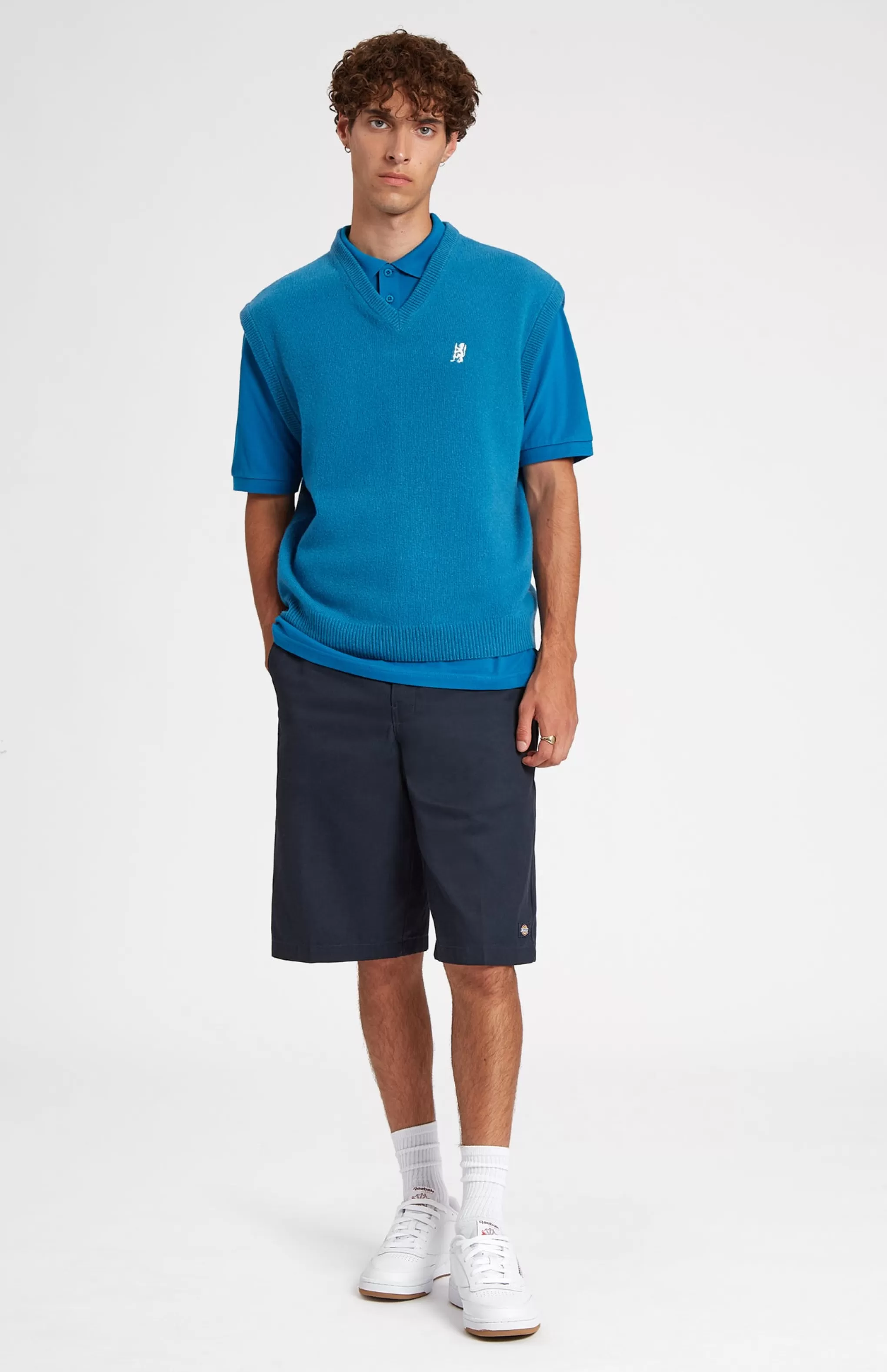 Fashion V Neck Sleeveless Golf Jumper In Lagoon With Golfing Lion Logo Men V Neck Knits